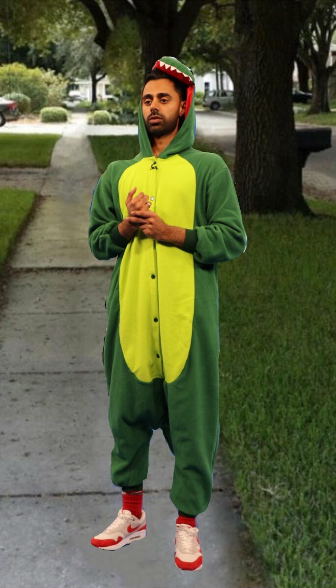 Hasan Minhaj in a dinosaur onesie during a sketch in his series 'The Patriot Act'